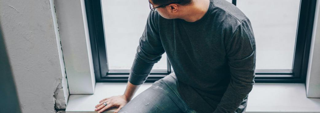 man-looks-out-window 2.jpg